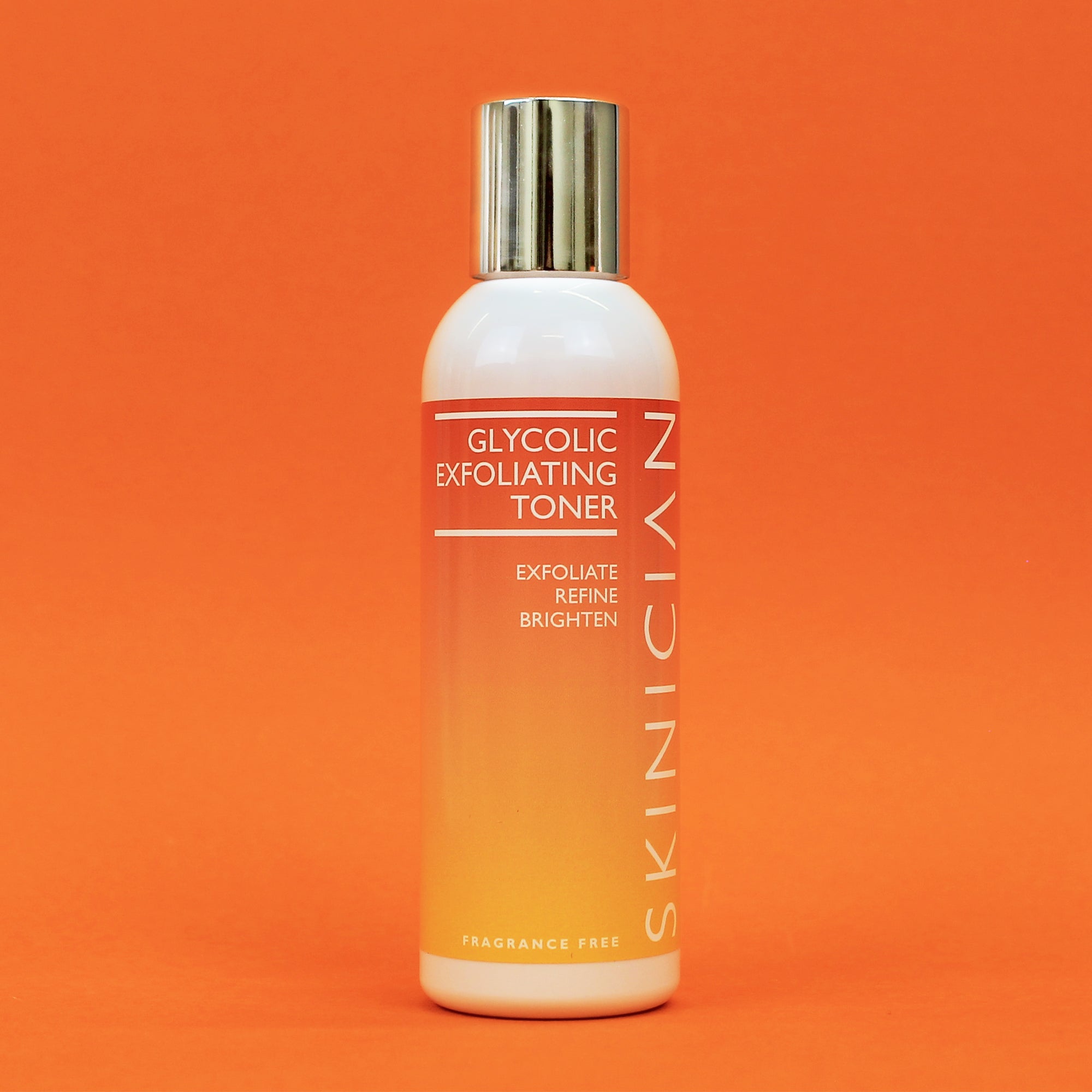 Skinician Glycolic Exfoliating Toner bottle on an orange background