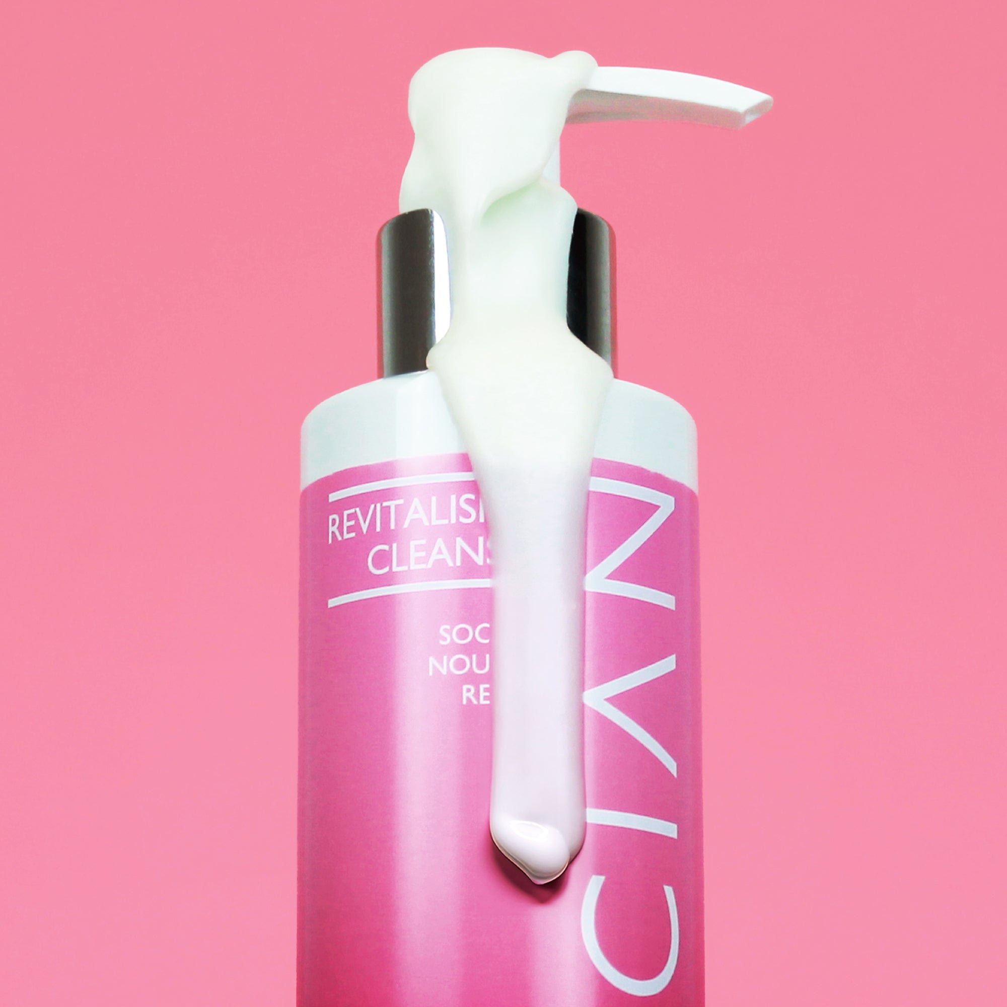 Skinician Revitalising Cleanser bottle with the cleanser running down the side to demonstrate its creamy formula