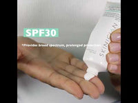 Youtube Video of a lady dispensing purifying daily moisturiser with SPF30 onto her hand and then applying to the face and neck.
