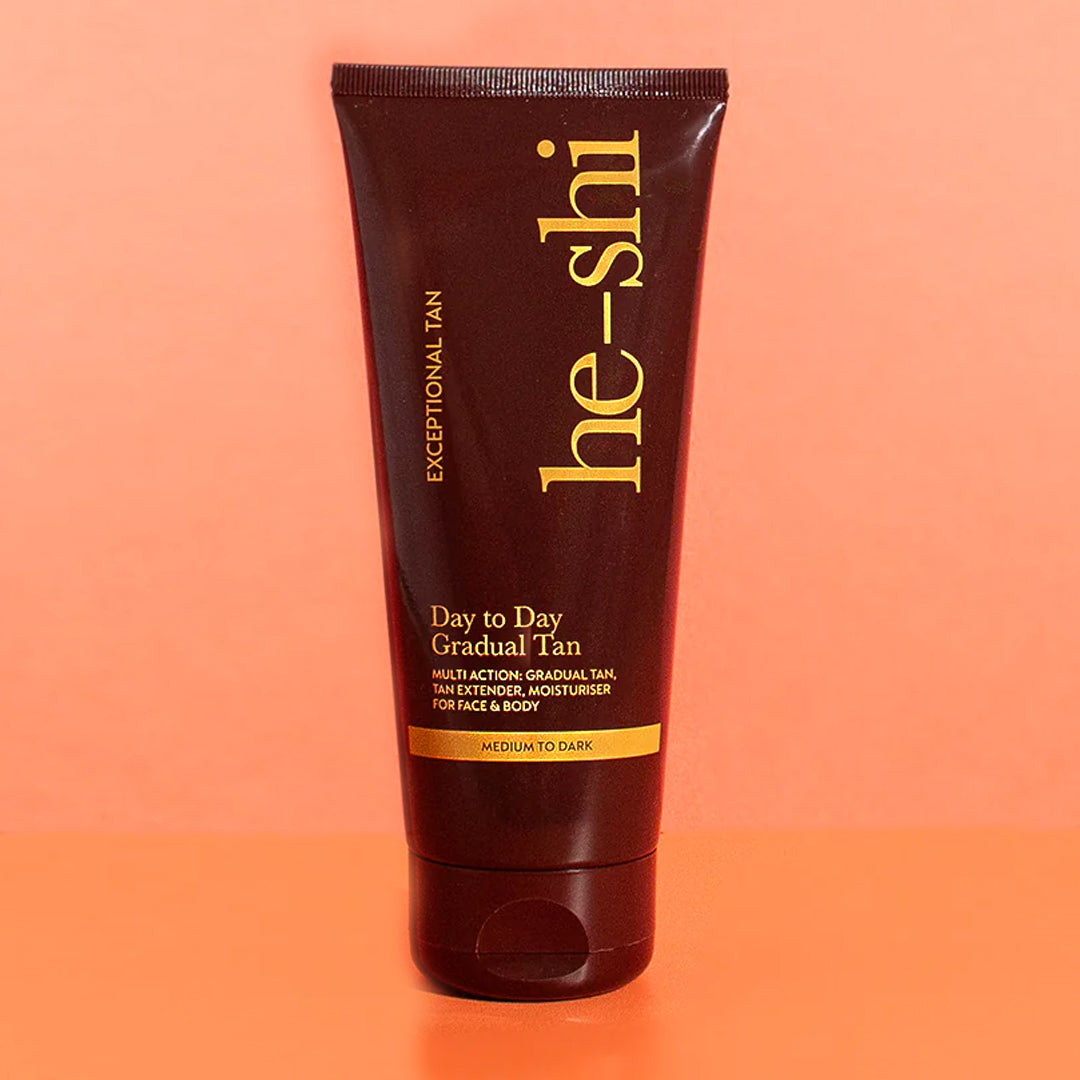 Image of He-Shi Dark Day to Day Gradual bottle on an orange background