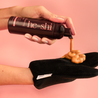 Image of hands pumping Dark Foaming Mousse onto a tanning mitt