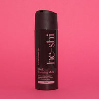 image of Dark Tanning Milk on pink background