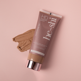 He-Shi HD Wonder Glow tanning product on a pink background