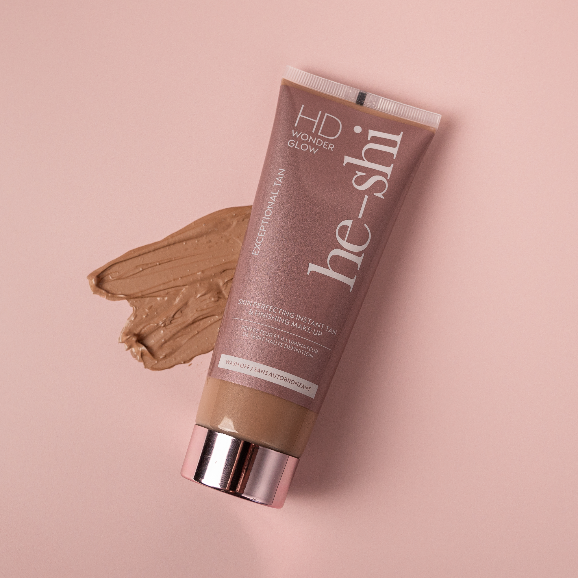 He-Shi HD Wonder Glow tanning product on a pink background