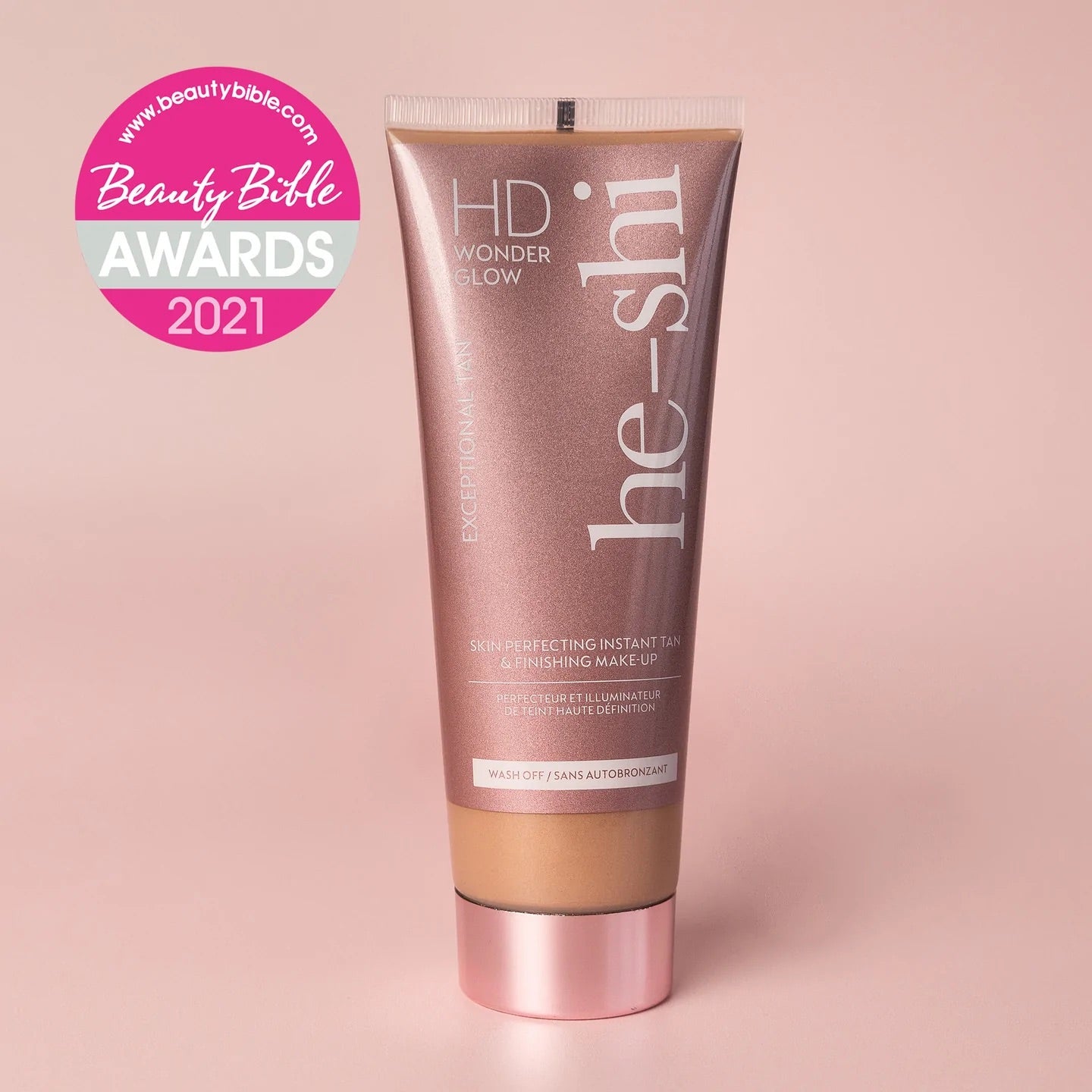 Tube of he-shi HD Wonder Glow on a pink background with Beauty Bible Awards 2021 logo.