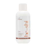 He-Shi Rich Bronze spray tan bottle on a white background
