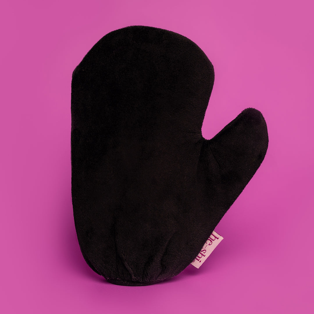 He-Shi Velvet Tanning Mitt on pink background