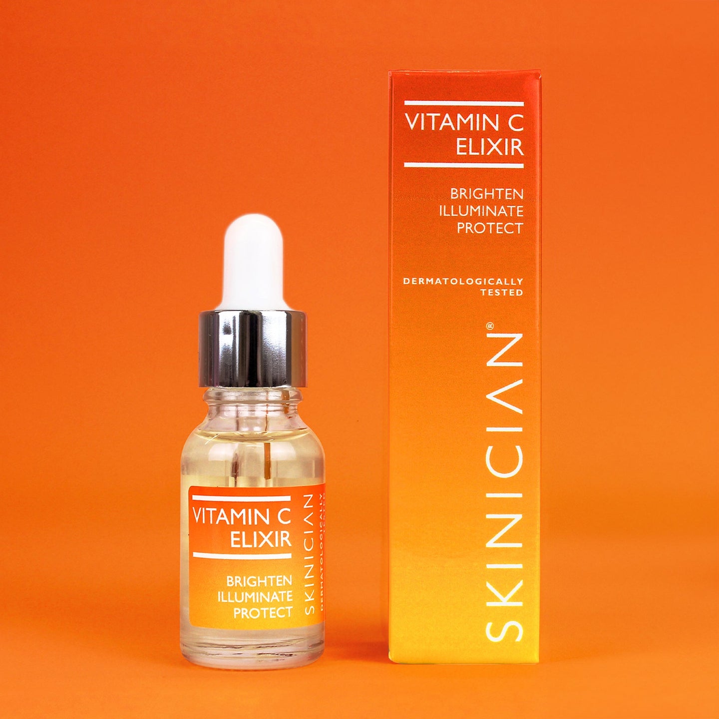 Vitamin C elixir bottle and packaging on an orange background