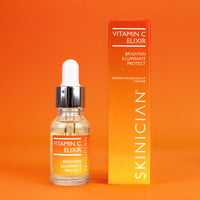 Vitamin C elixir bottle and packaging on an orange background