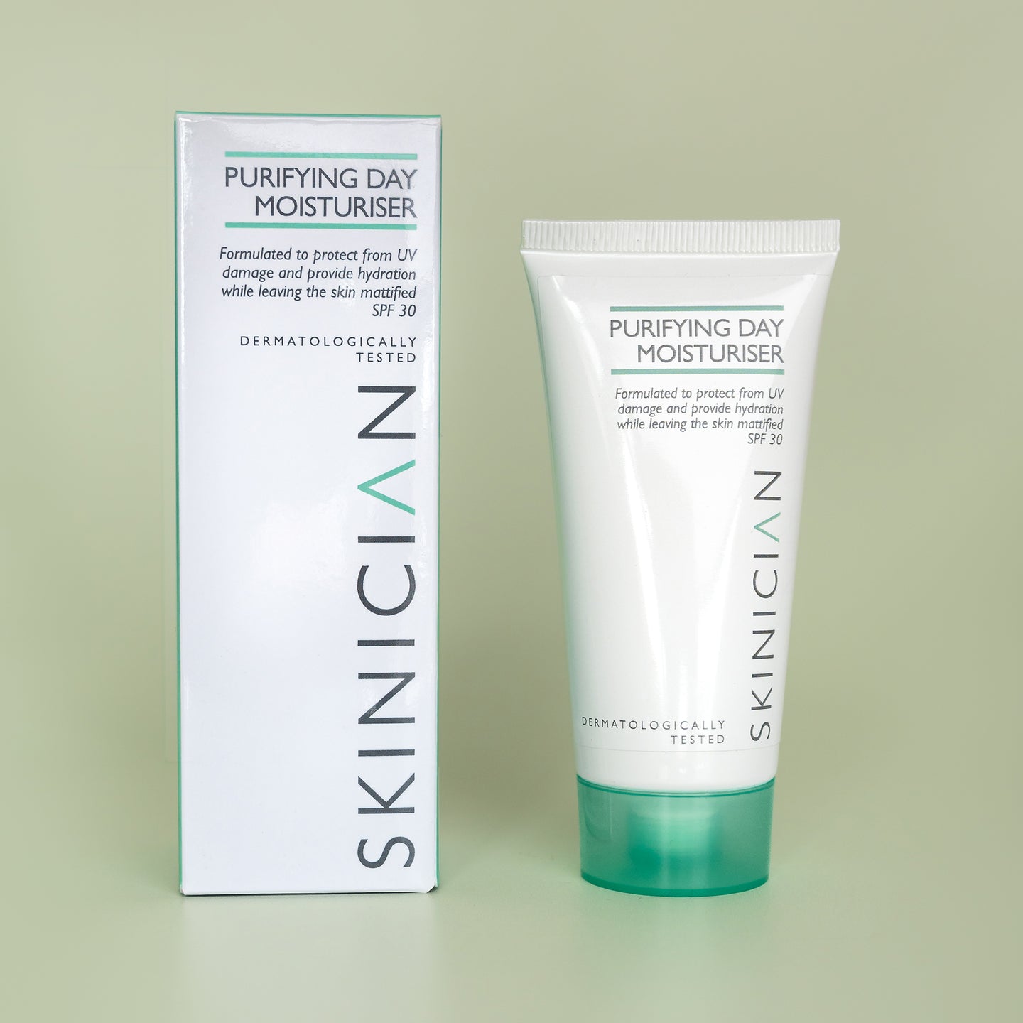 Skinician purifying day moisturizer tube and packaging on a light green background