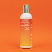 Skinician Glycolic Exfoliating Toner bottle on an orange background