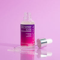 Hyaluronic Elixir bottle with dropper on purple background