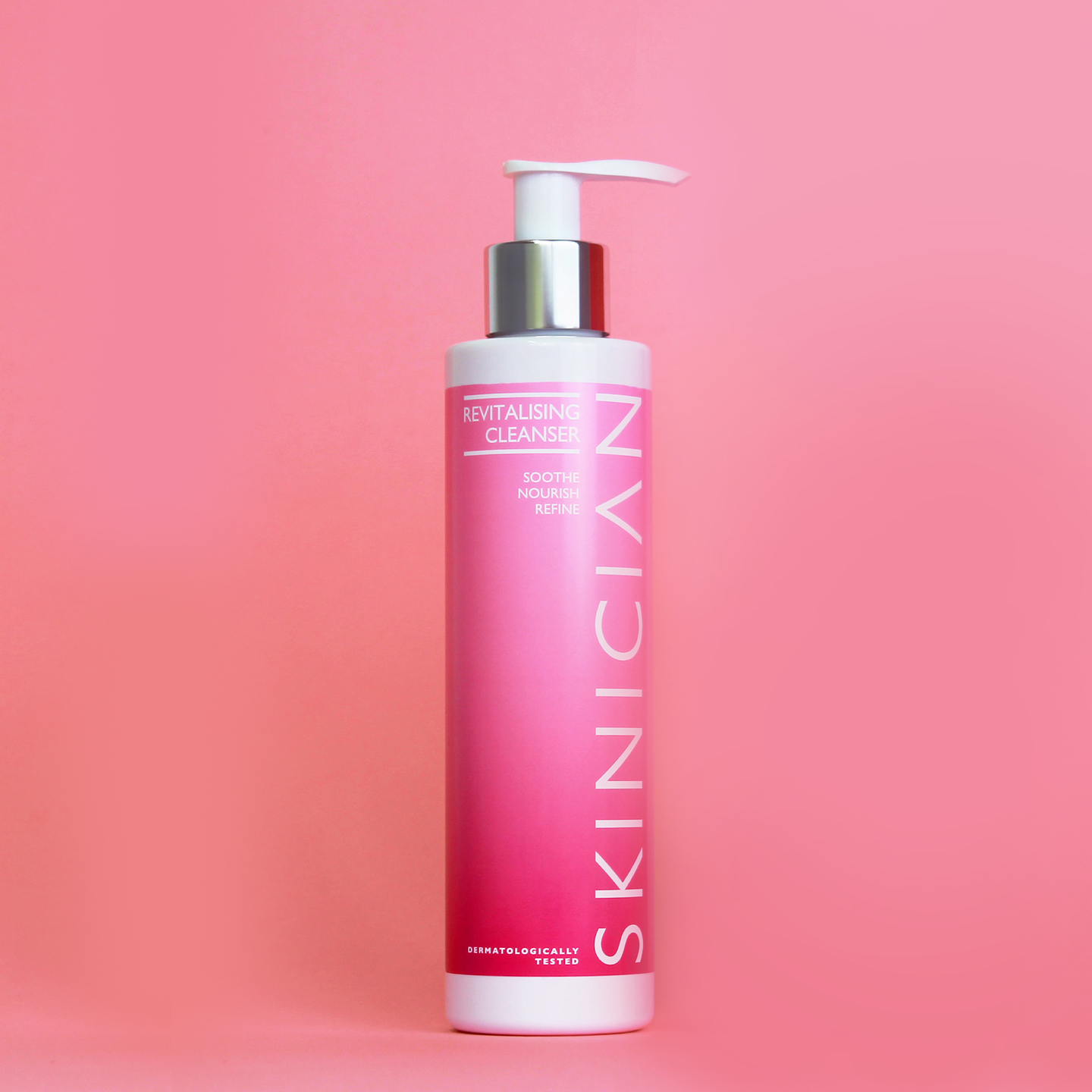 Image of Skinician Revitalising Cleanser bottle on pink background