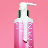 Skinician Revitalising Cleanser bottle with the cleanser running down the side to demonstrate its creamy formula