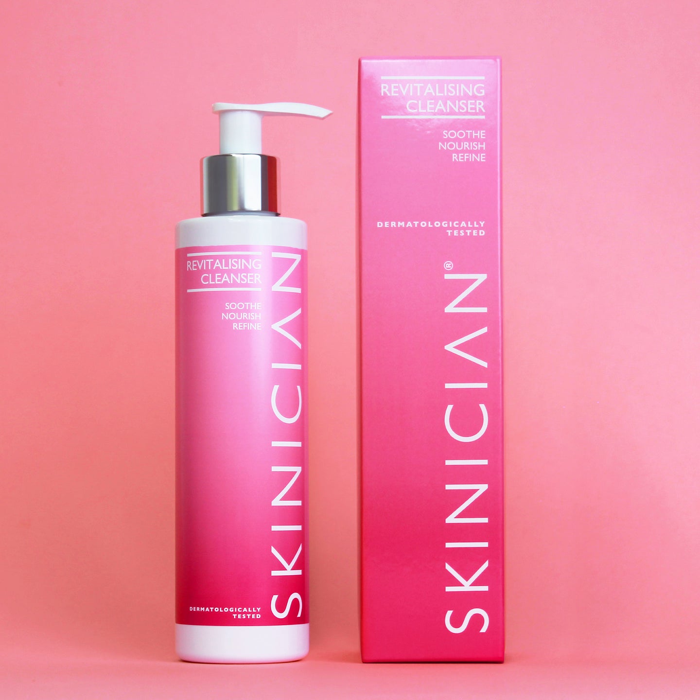 Skinician revitalising cleanser bottle and packaging on a pink background