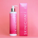 Skinician revitalising cleanser bottle and packaging on a pink background