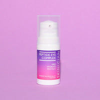Skinician Peptide Eye Complex bottle on a purple background