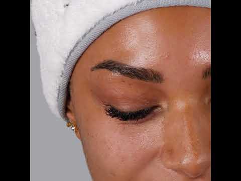 Youtube video of a lady unboxing the repair face mask tube and appealing the creamy rich mask to the face.