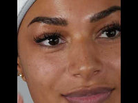 YouTube video of SKINICIAN Calming serum for face. Shows lady removing tube from the carton, dispensing onto fingertips and applying to face.  A quartz roller is used to massage face and neck.