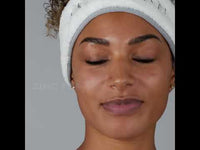 A youtube video of lady unboxing the purifying toner and spritz it onto her skin.