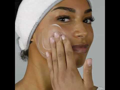Youtube video of a lady cleansing her face with the milky revitalising cleanser after removing it from its box.