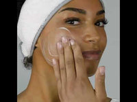 Youtube video of a lady cleansing her face with the milky revitalising cleanser after removing it from its box.