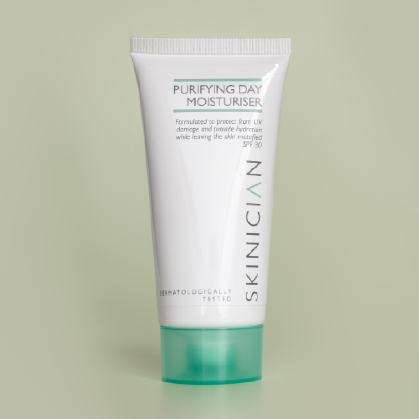 Tube of Skinician Purifying Day Moisturiser on a light green background