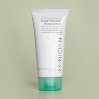 Tube of Skinician Purifying Day Moisturiser on a light green background