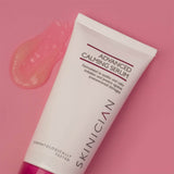 Tube of Skinician Advanced Calming Serum on a pink background