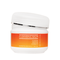 Cleansing balm jar with orange label on a white background