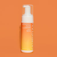 Image of Skinician Pro-Radiance Enzyme Cleanser bottle on orange background