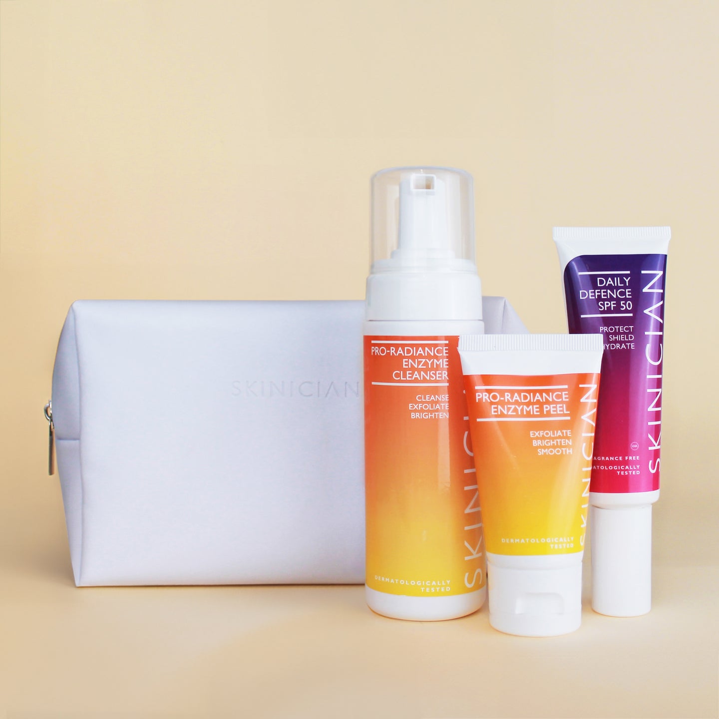 Image of Skinician Get Up & Glow Skincare Set and the products inside on a beige background. 