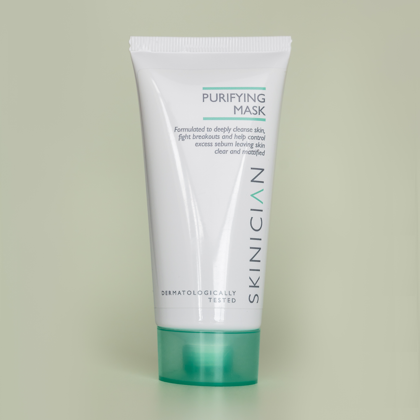 Tube of Skinician Purifying Mask on a light green background