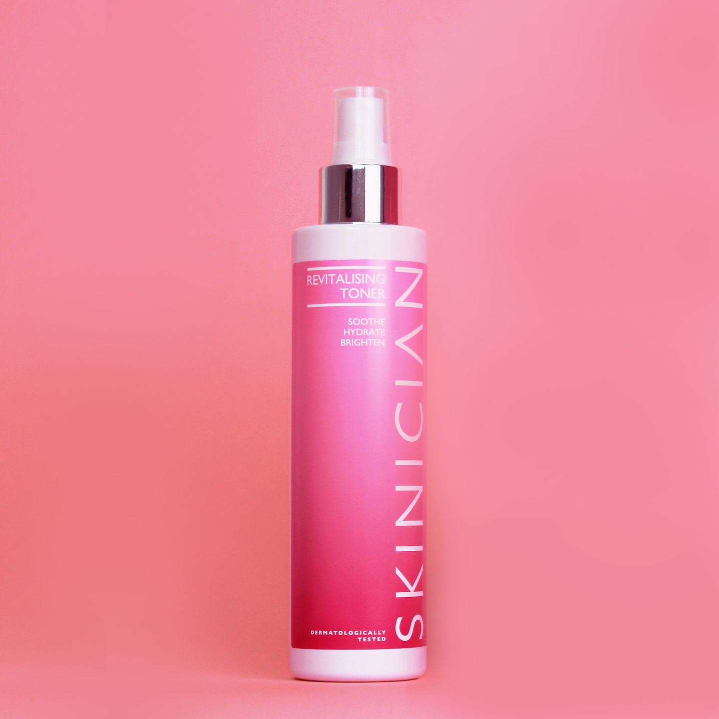 SKINICIAN revitalising toner bottle on a pink background