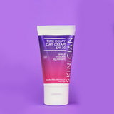 Tube of Skinician Time Delay Day Cream SPF 30 on a purple background